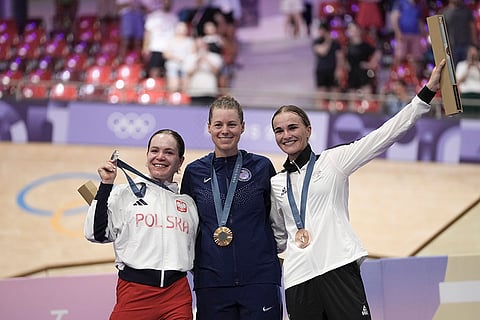 Paris Olympics Track Cycling women's omnium event: Jennifer Valente of the United States (Gold) with Daria Pikulik of Poland (silver), left, and Ally Wollaston of New Zealand (bronze)